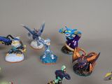 many figurines of different types and colors on the table