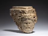 marble head of a man with a goat ' s head on top of it