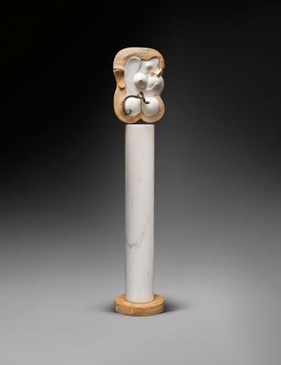 an image of a statue of a bear on a pole