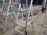 many ladders that are sitting in a building