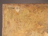 a large piece of rust on the side of a wall