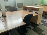 an image of an office with a desk and chairs