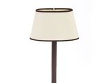 a small lamp with a white shade on top of it