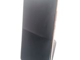 a cell phone that is sitting on a cell phone stand
