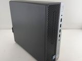 a black desktop computer sitting on top of a white table