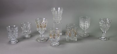 a lot of glasses that are sitting on a table