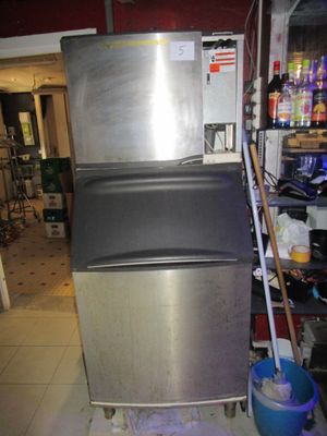 an image of a stainless steel ice maker in a kitchen