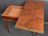 an old wooden table with a drawer on top of it