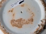 a white plate with a smiley face on it