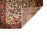 an antique persian rug with a floral design on a white background
