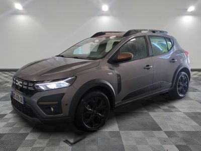 a grey suv parked in a garage with a checkered floor