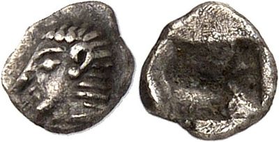 a silver coin with a face on the front and a face on the back