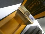a gold box with a gold coin inside of it