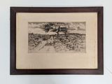 painting of a lone tree in a desert landscape in a wooden frame