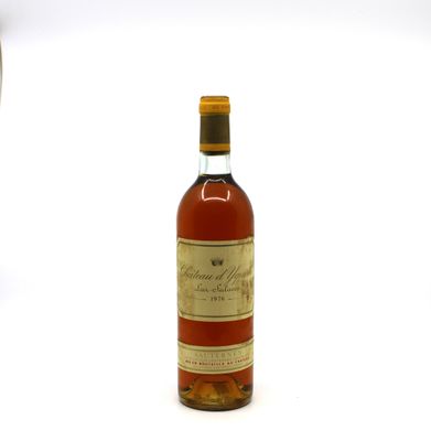 an image of a bottle of wine next to a glass of wine