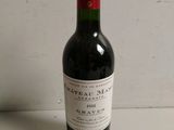 a bottle of wine that is sitting on a table