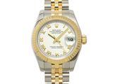 a lady ' s rolex watch with a white dial and roman numerals