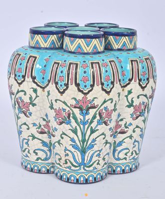 a blue and white vase sitting on a white surface