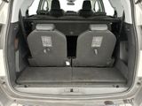 two seats in the back of a car with the doors open