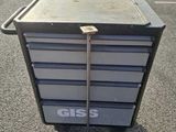 a metal cart that is sitting in the parking lot