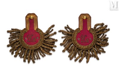 pair of pink and gold earrings with a heart on the back