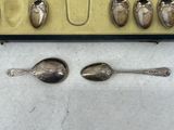 five spoons and two spoon spoons in a box
