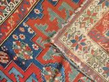 an image of a close up of a red and blue oriental rug
