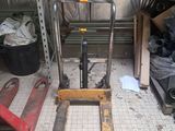 a picture of a forklift in a garage with a lot of tools