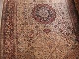 an image of a living room with a rug on the floor