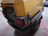a yellow box sitting on the back of a truck