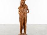 an image of a wooden sculpture of a man and a woman