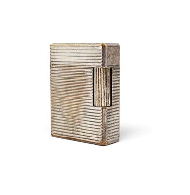 a silver lighter sitting on top of a white surface