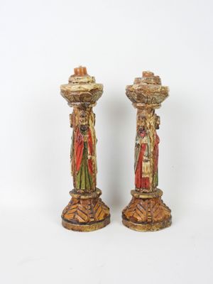 pair of antique painted wooden candlesticks with figures of jesus and mary