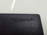 a close up of a black cell phone on a table
