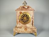 a clock that is sitting on top of a table