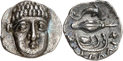 a silver coin with an image of a man ' s face on it