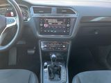 a dashboard of a car with a steering wheel and dashboard controls