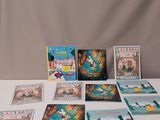 a white table topped with books and cards on top of a white table