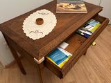 a small table with a book on top of it