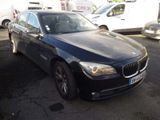 a picture of a black bmw parked in a parking lot