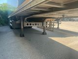 a truck that has a flat bed on the back of it