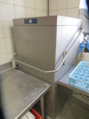 an image of a kitchen with a sink and a freezer