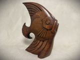 an image of a wooden sculpture of a fish on a white background