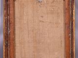 an old wooden picture frame with a piece of fabric on it