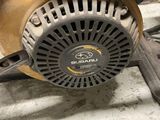 an image of a close up of a small engine in a garage