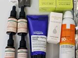 many different types of skin care products laid out on a table