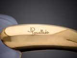 a close up of a gold ring with a name engraved on it