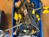 a box of tools sitting on the floor next to a dolly