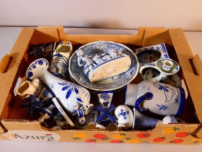 a box full of blue and white china items