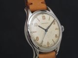 an image of a close up of a wrist watch on a black background